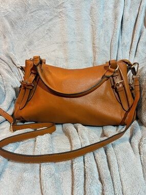 Brown leather hobo bag by the brand Kattee